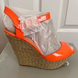 Neon orange patent leather platform wedge sandals by Jessica Simpson; size 9